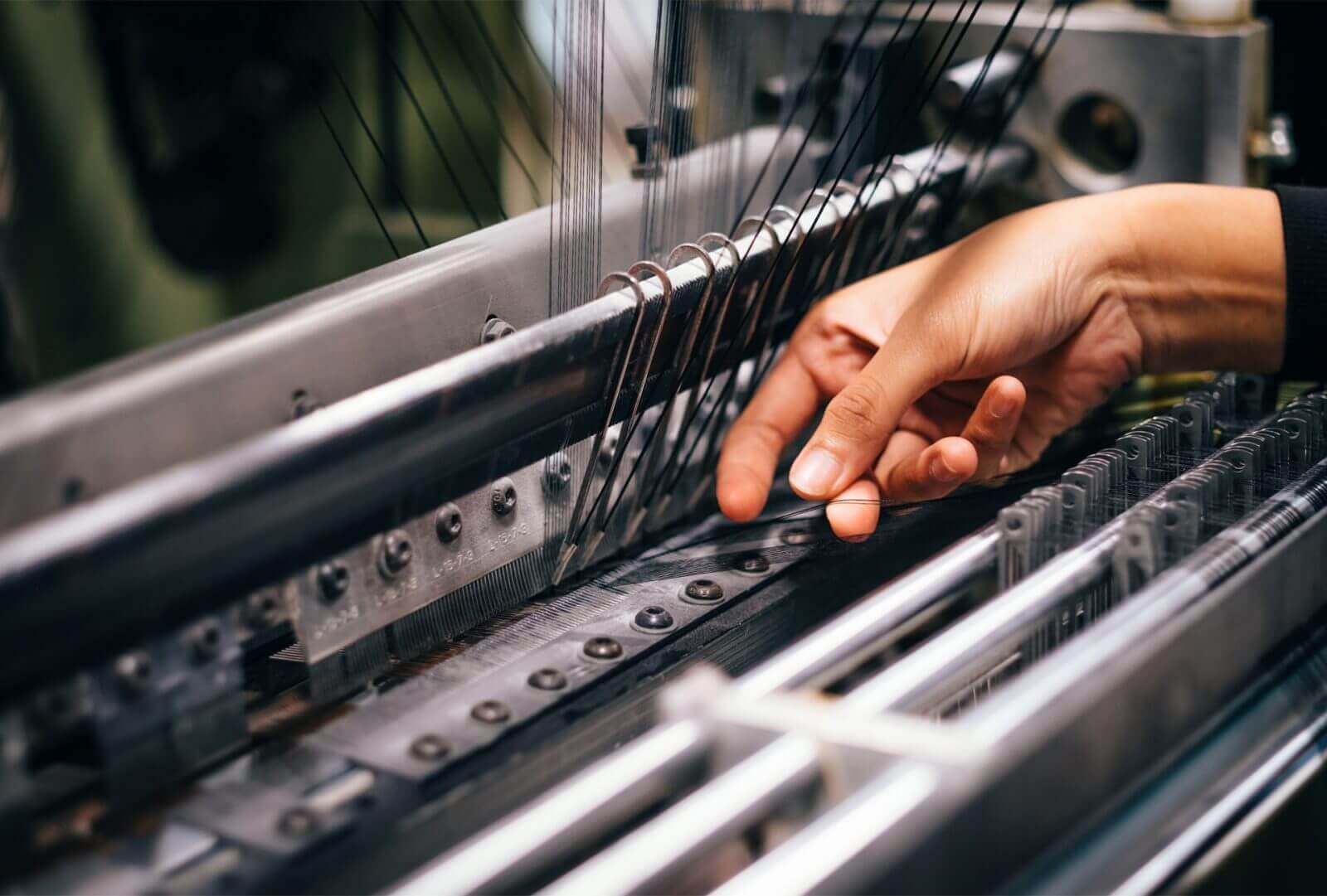Precision craftsmanship at the Luxxe Clothing factory