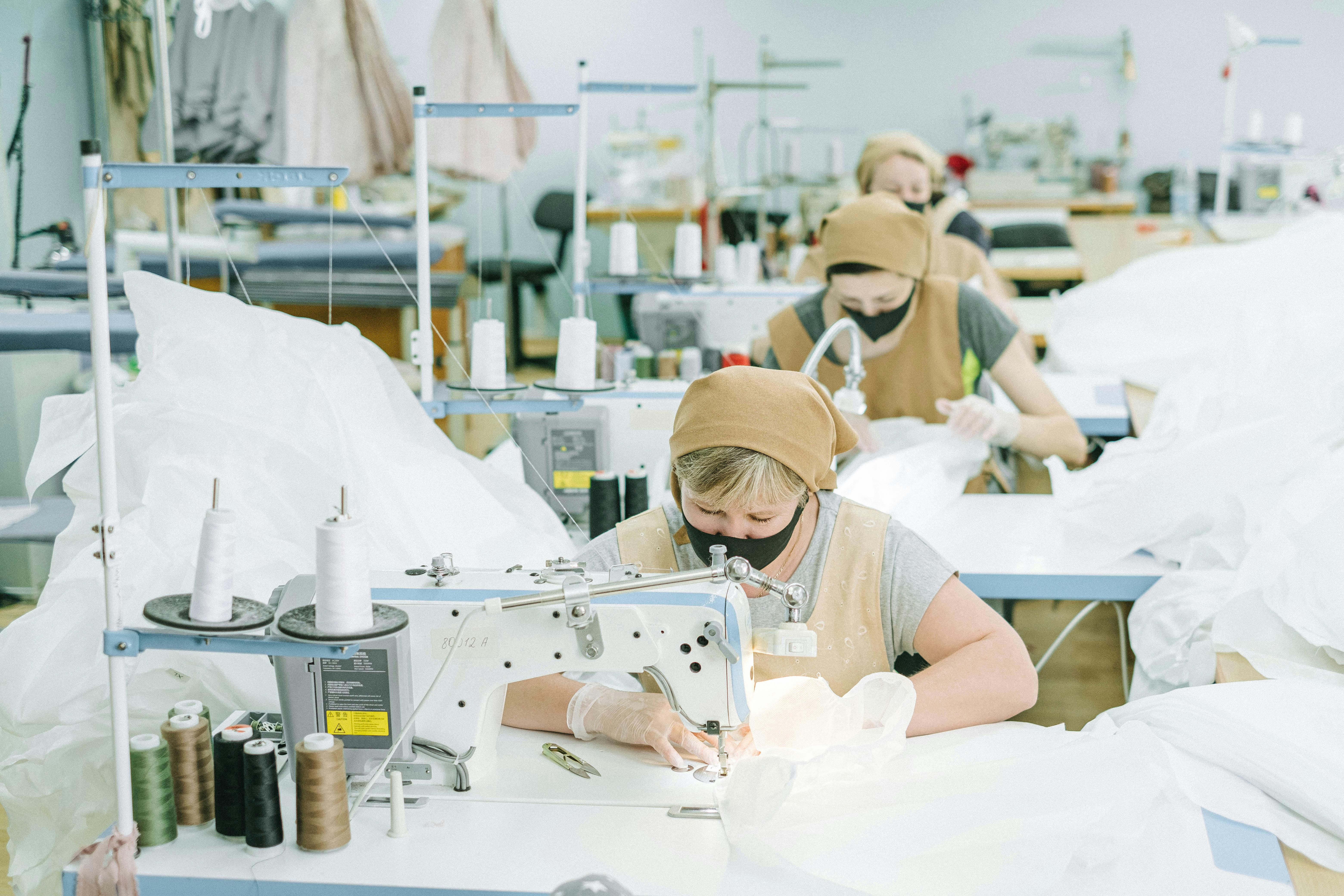 Luxxe Clothing factory floor with seamstresses at work